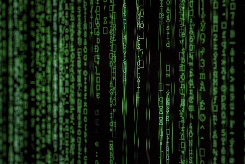 Streams of glowing blue digital data flowing across a dark screen